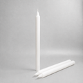 Three white straight wax pillar candles