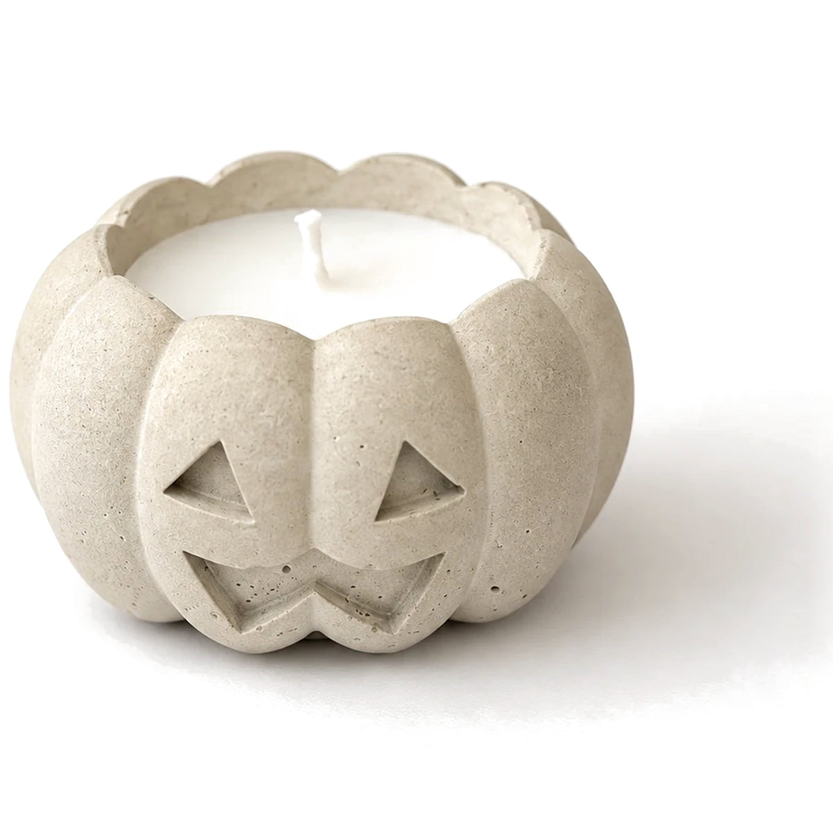 White concrete jack-o'-lantern candle, close-up