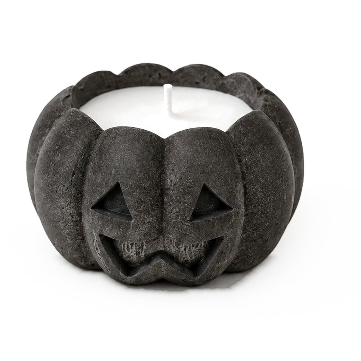 Graphite concrete jack-o'-lantern candle, close-up