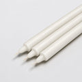 Close-up of three white pillar candles